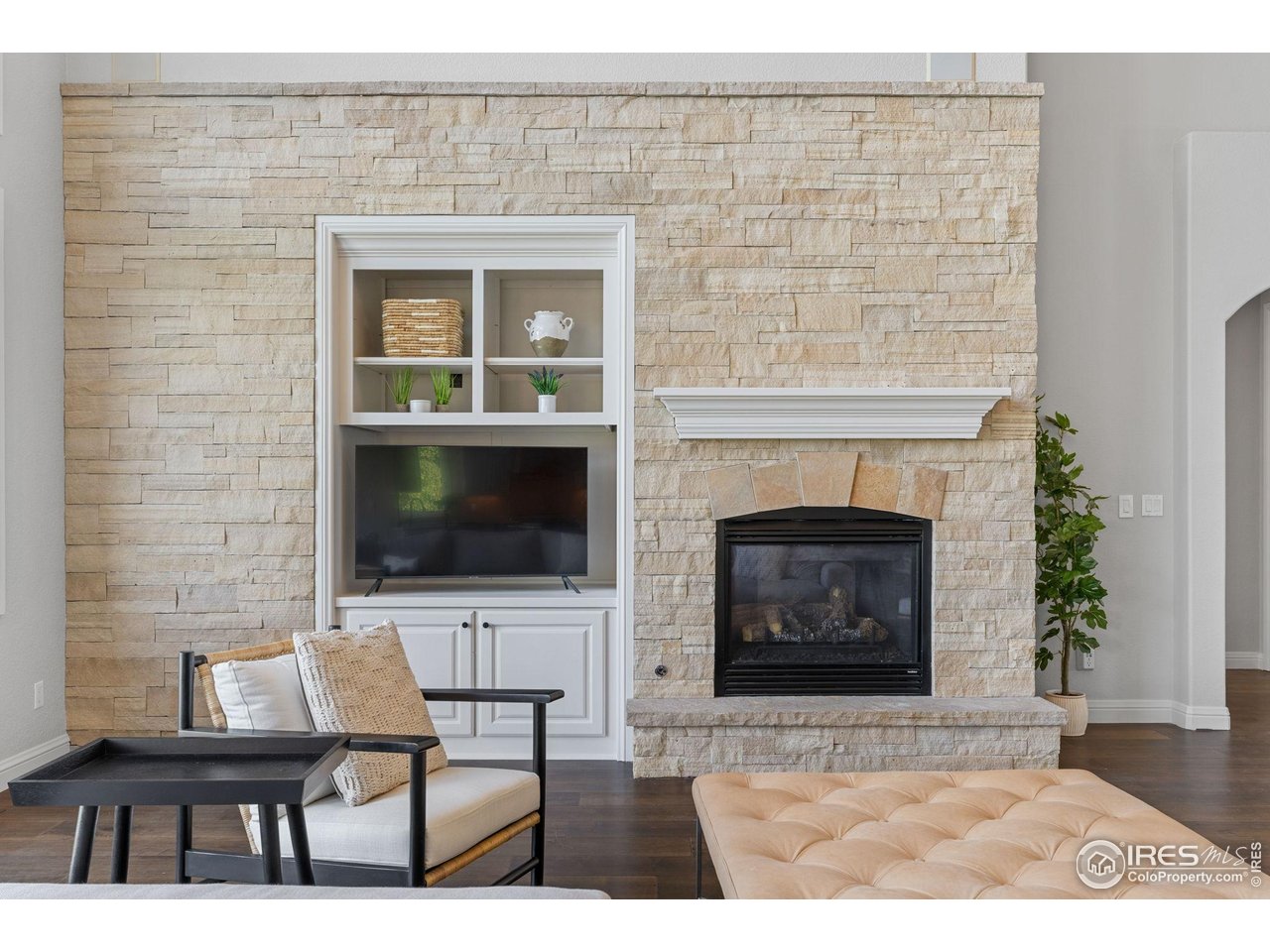 6557 Legend Ridge Trail Niwot, CO 80503 - Photo 7 of 42 Gorgeous Stone Fireplace Hearth