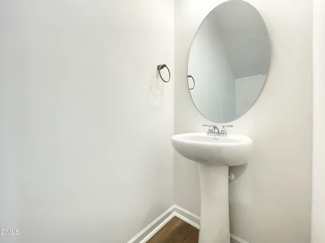 a bathroom with a sink and mirror