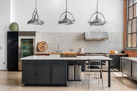 a kitchen with a stove and cabinets