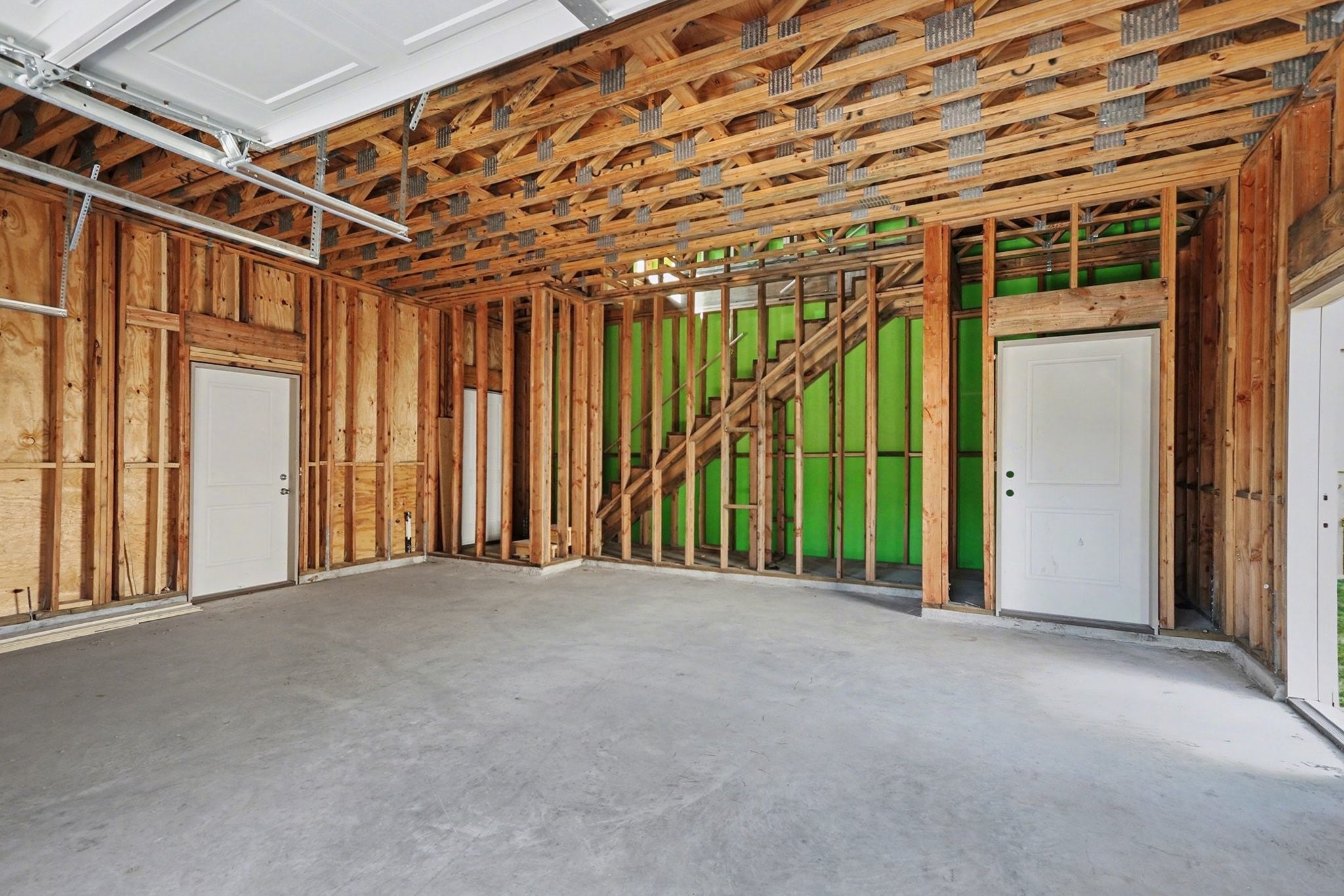 1901 Lexington Street Houston, TX 77098 - Photo 27 of 32 Spacious garage with direct access to a private apartment via its own door and stairway on the south side of the building, offering convenience and privacy.