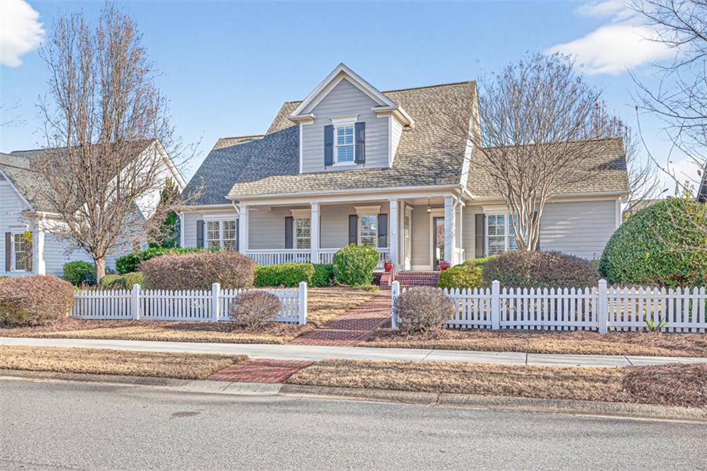 403 Tralee Court Statham, GA 30666 - Photo 2 of 98 a front view of a house with a garden