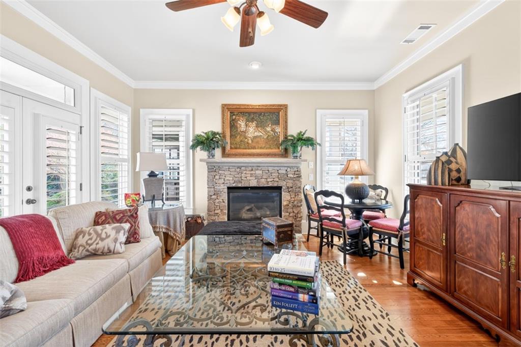 403 Tralee Court Statham, GA 30666 - Photo 50 of 98 a living room with furniture a fireplace and a flat screen tv