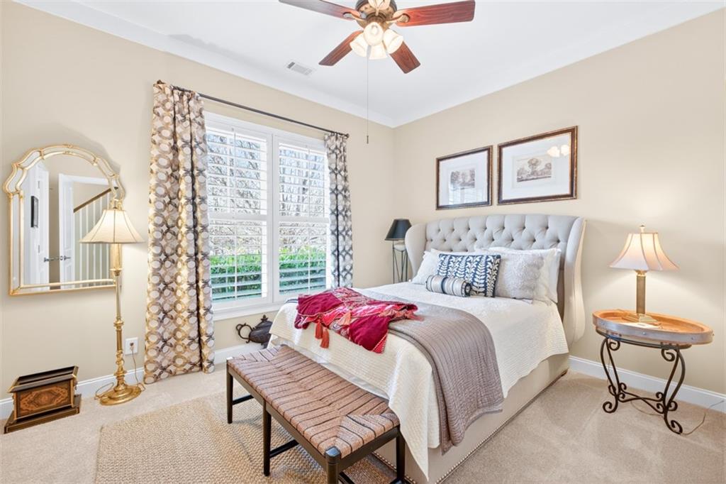 403 Tralee Court Statham, GA 30666 - Photo 51 of 98 a bedroom with a bed and a window