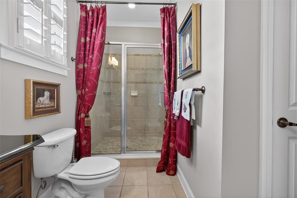 403 Tralee Court Statham, GA 30666 - Photo 55 of 98 a bathroom with a shower and a toilet