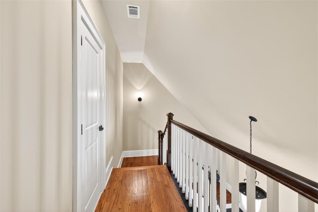403 Tralee Court Statham, GA 30666 - Photo 56 of 98 a view of a hallway with wooden floor and staircase