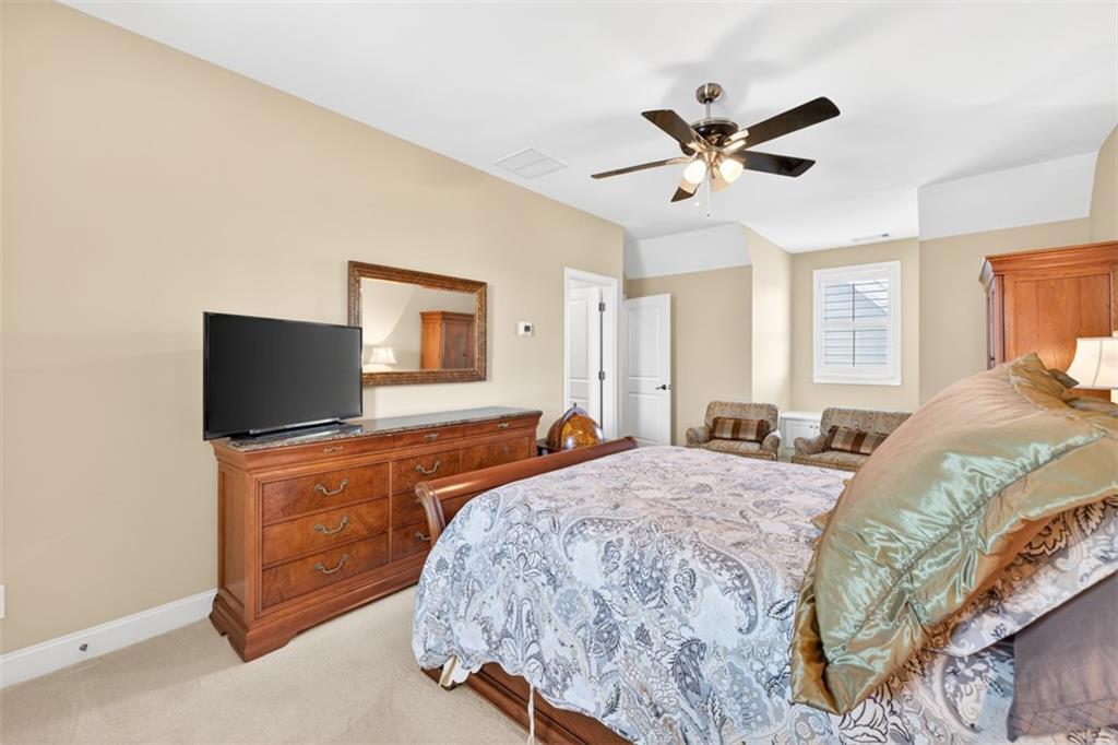 403 Tralee Court Statham, GA 30666 - Photo 57 of 98 a bedroom with a bed and a flat screen tv