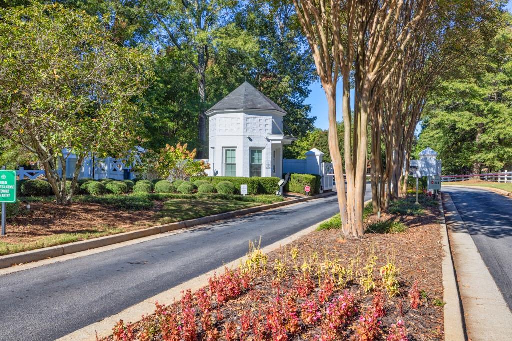 403 Tralee Court Statham, GA 30666 - Photo 92 of 98 a front view of a house with a yard and tree s