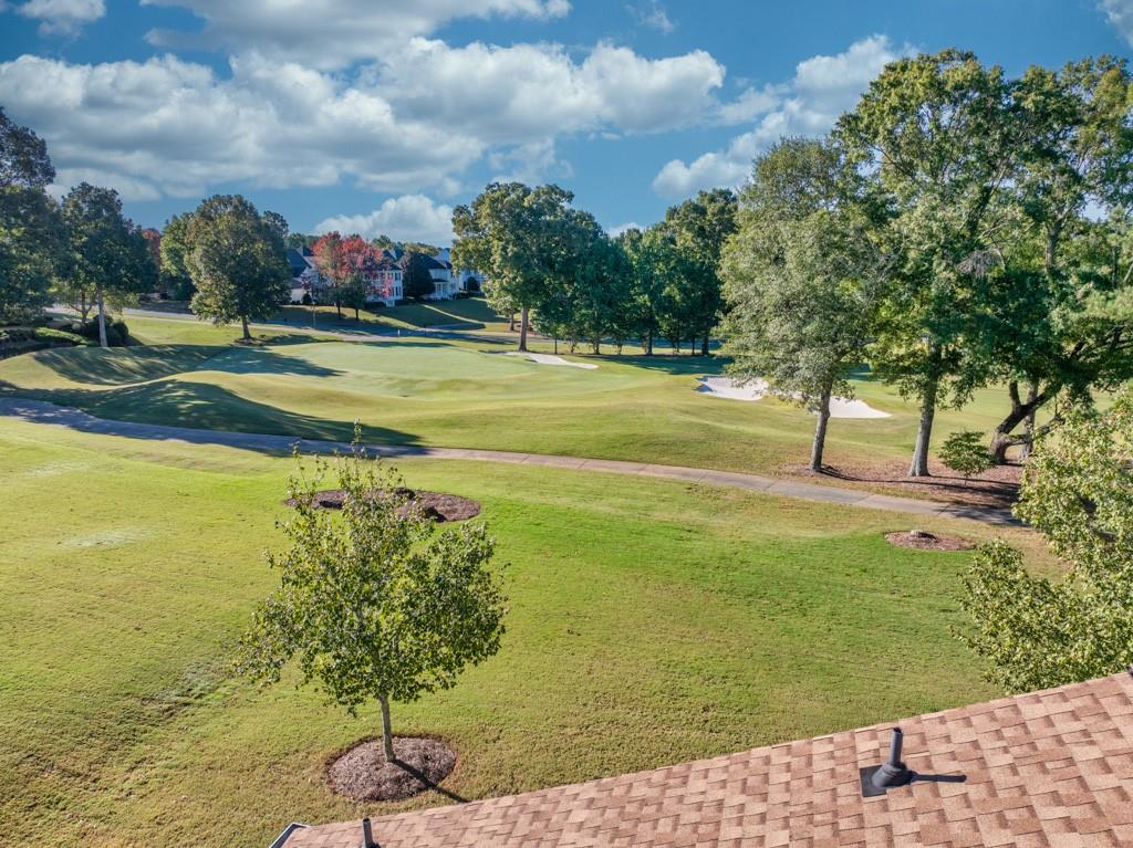403 Tralee Court Statham, GA 30666 - Photo 94 of 98 a view of swimming pool with outdoor seating and trees in the background