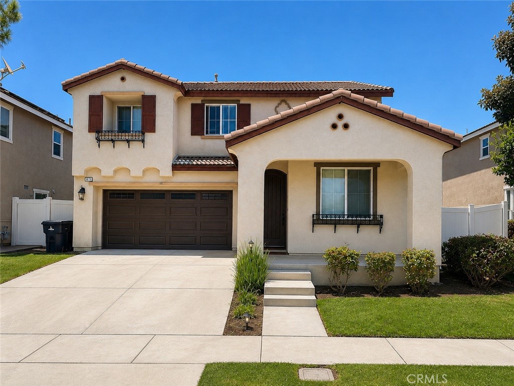 1646 Palermo Drive Riverside, CA 92507 - Photo 1 of 9 a front view of a house with a yard and garage
