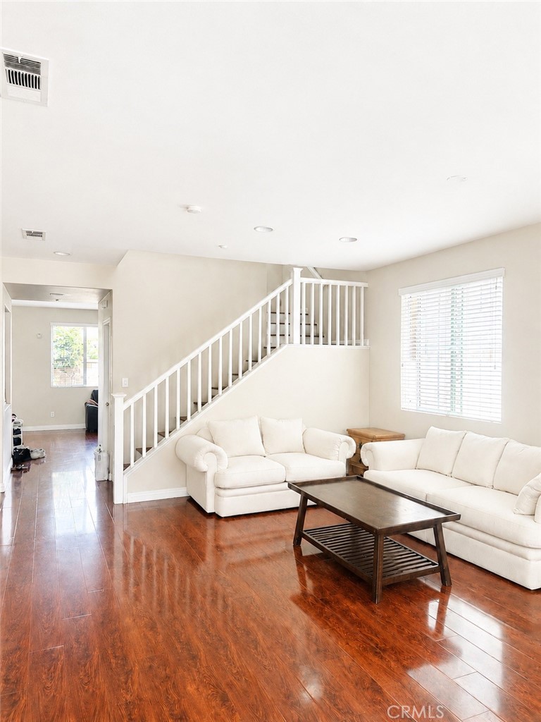 1646 Palermo Drive Riverside, CA 92507 - Photo 2 of 9 a living room with furniture and a wooden floor