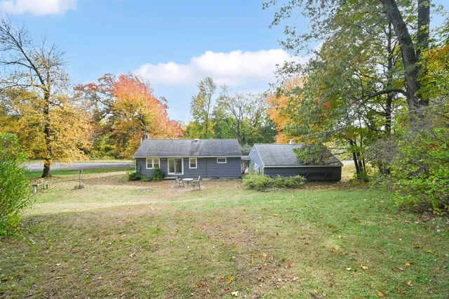 a view of a chairs and table in the yard
