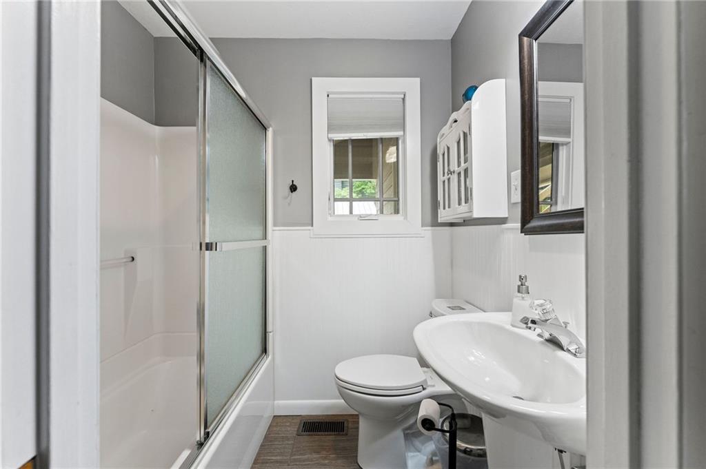 221 Reece Creek Road West Blairsville, GA 30512 - Photo 10 of 42 a bathroom with a sink and mirror with toilet