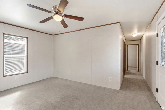 2875 North Hill Field Road, Unit 62 Layton, UT 84041 - Photo 17 of 34 Interior room featuring light gray carpet, white wall panels, and dark wood-finish trim