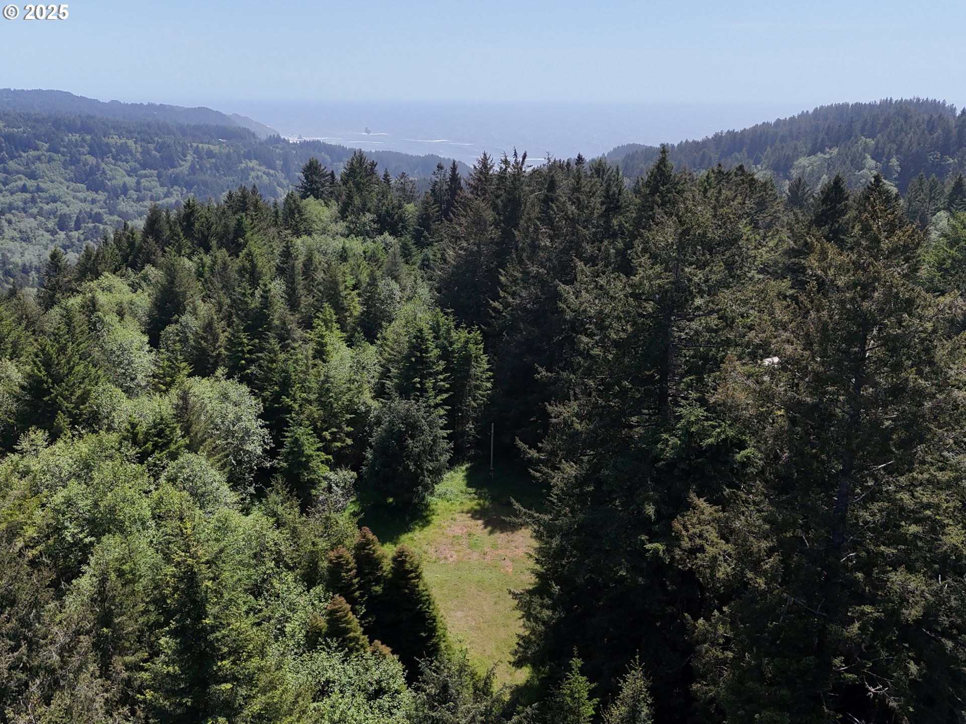 20452 Whaleshead Road Brookings, OR 97415 - Photo 21 of 40 an aerial view of mountain with green space