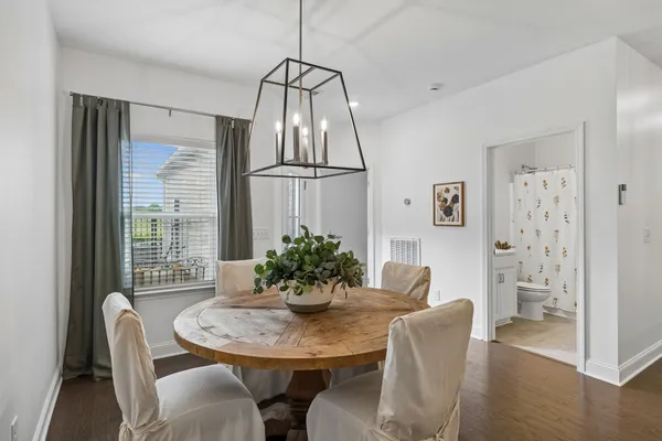 a view of a dining room with furniture window and wooden floor