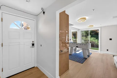 a kitchen with stainless steel appliances a refrigerator and a stove