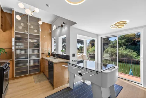 a kitchen with stainless steel appliances granite countertop a stove and a refrigerator
