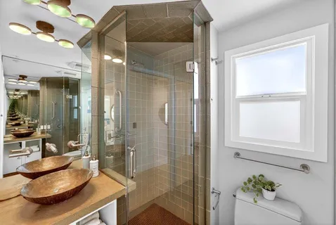 a view of a wooden deck and a garden