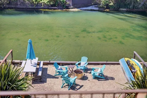 a view of a yard with a table and chairs