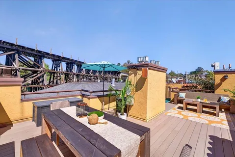 a view of a swimming pool with a patio and a garden