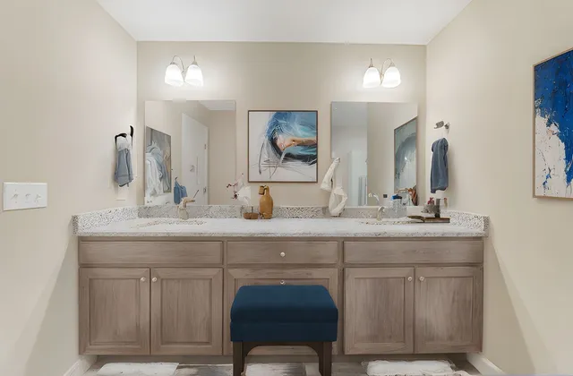 a bathroom with a double vanity sink and a mirror