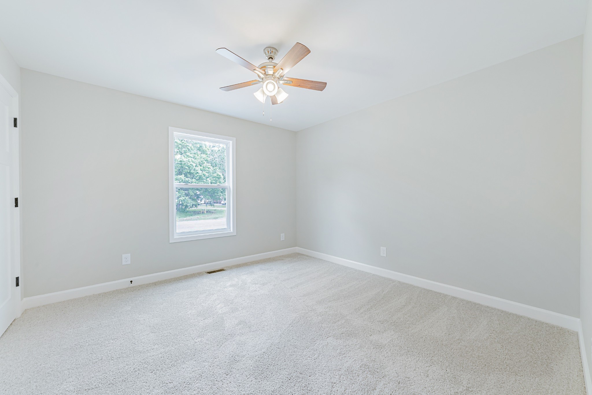 341 Wiseman Road Tullahoma, TN 37388 - Photo 15 of 21 an empty room with windows and fan