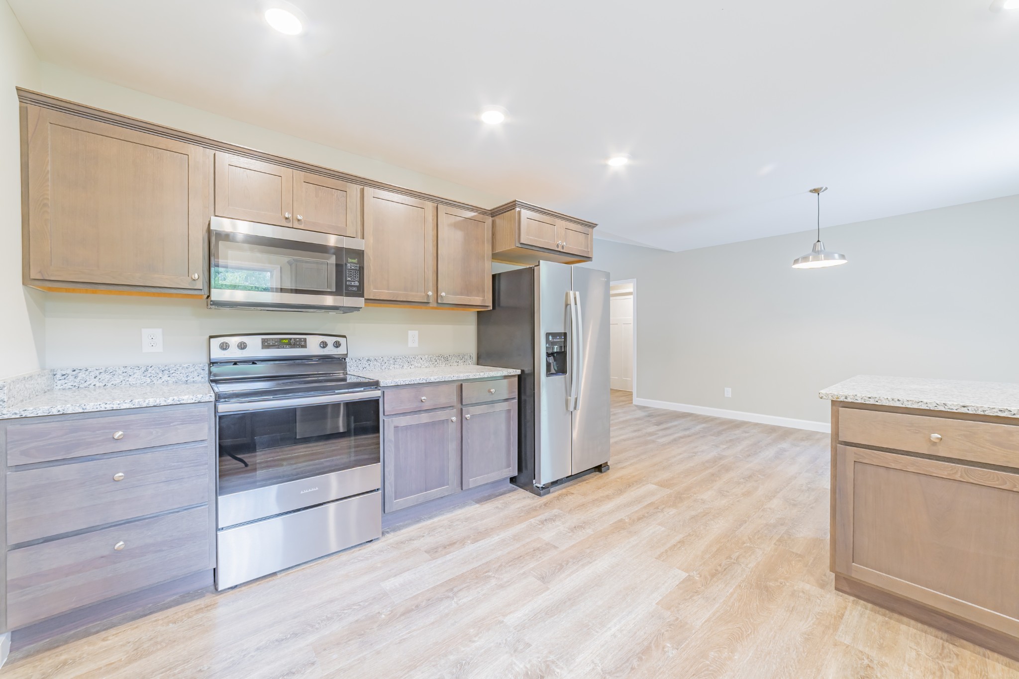 341 Wiseman Road Tullahoma, TN 37388 - Photo 6 of 21 a kitchen with a refrigerator and a stove top oven