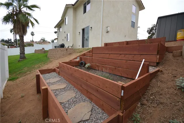 a view of a backyard with sitting area