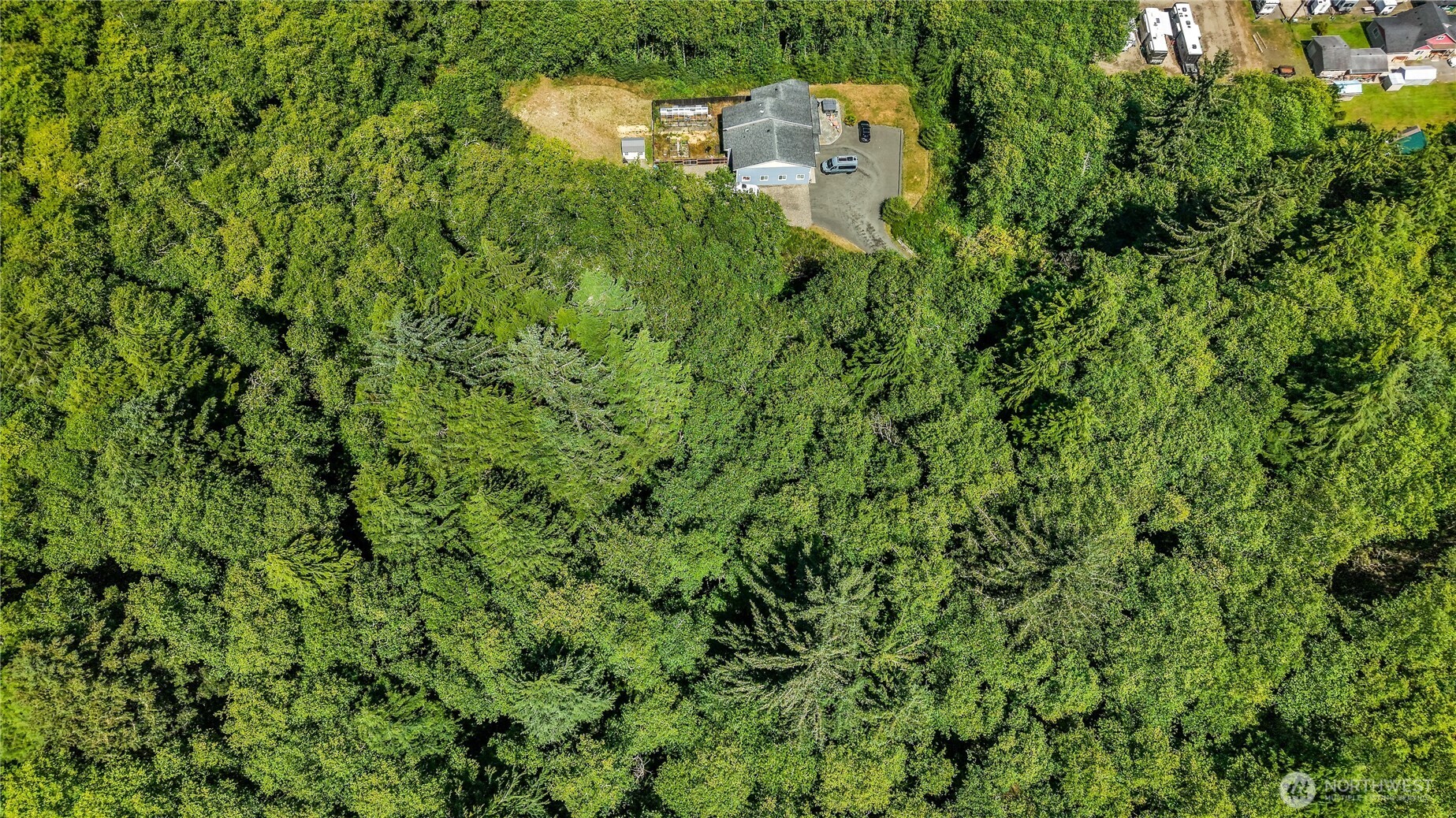 5001 4th Avenue Southwest Ilwaco, WA 98624 - Photo 17 of 22 an aerial view of a house with a yard