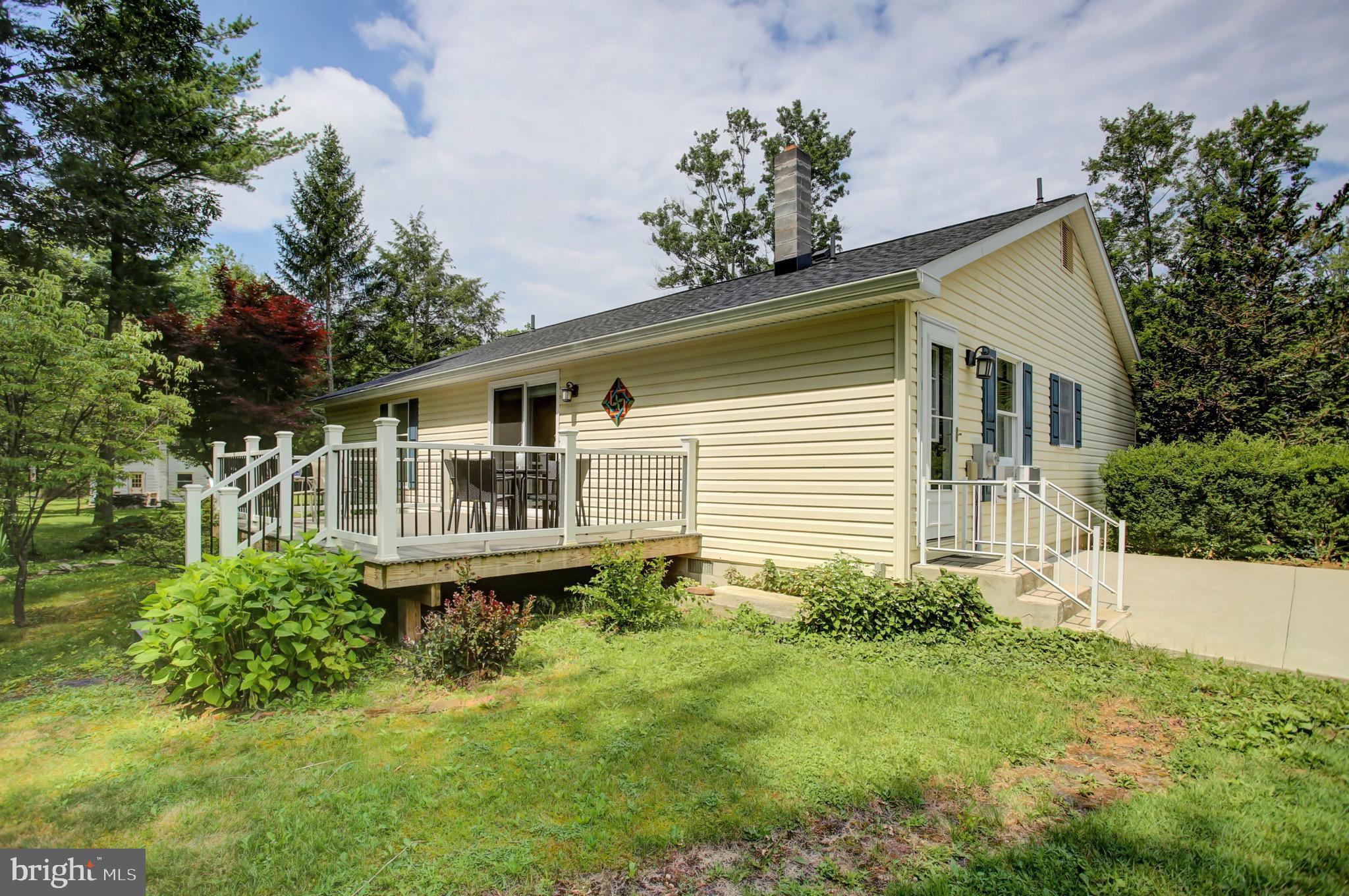 21796 Amberson Road Spring Run, PA 17262 - Photo 5 of 39 a front view of a house with a yard and potted plants