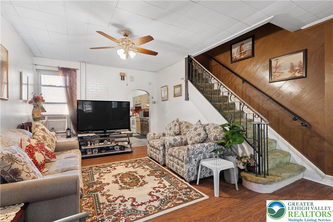 535 North Front Street Allentown, PA 18102 - Photo 30 of 51 a living room with furniture and a flat screen tv with wooden floor
