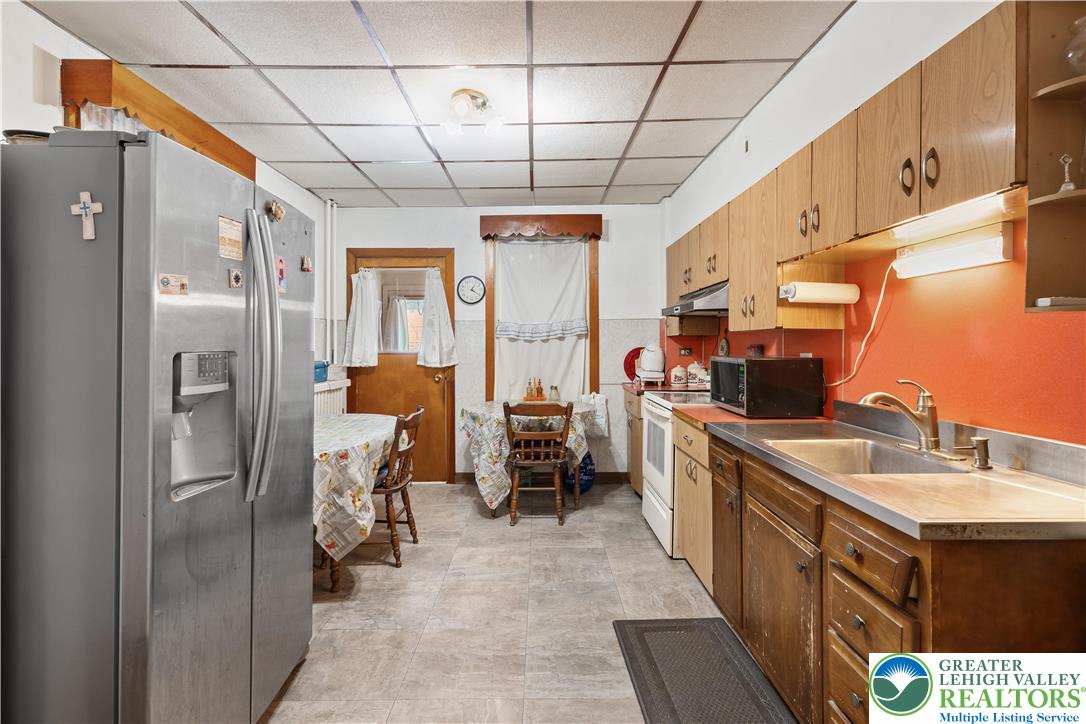 535 North Front Street Allentown, PA 18102 - Photo 31 of 51 a kitchen with sink cabinets and refrigerator