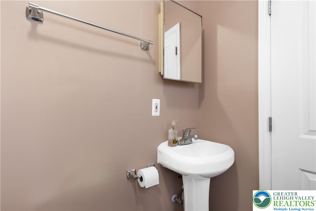 535 North Front Street Allentown, PA 18102 - Photo 36 of 51 a bathroom with a sink a mirror and shower