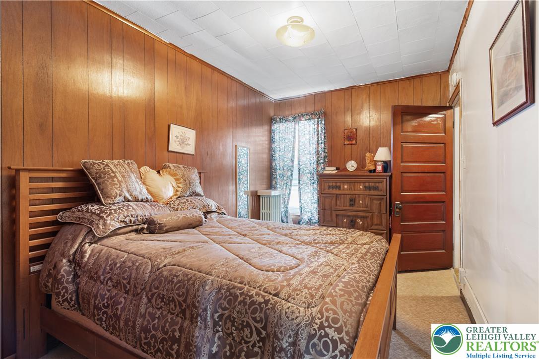 535 North Front Street Allentown, PA 18102 - Photo 40 of 51 a bedroom with a bed and wooden floor