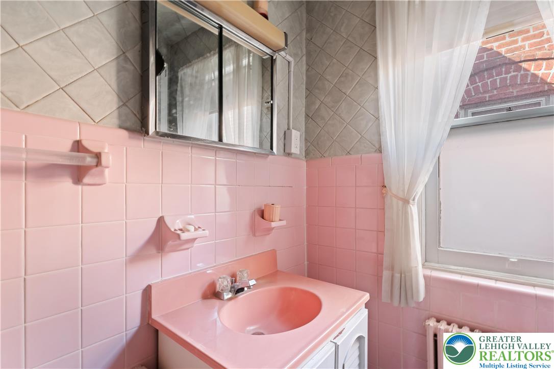 535 North Front Street Allentown, PA 18102 - Photo 45 of 51 a bathroom with a sink and a mirror
