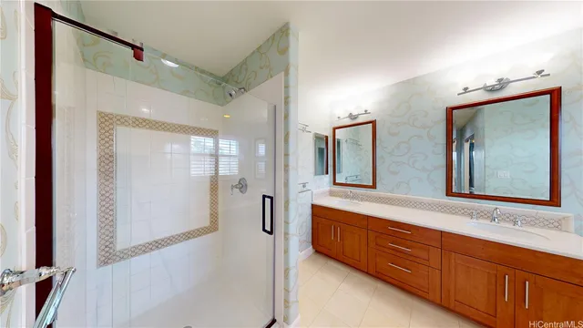 a bathroom with a double vanity sink mirror and double