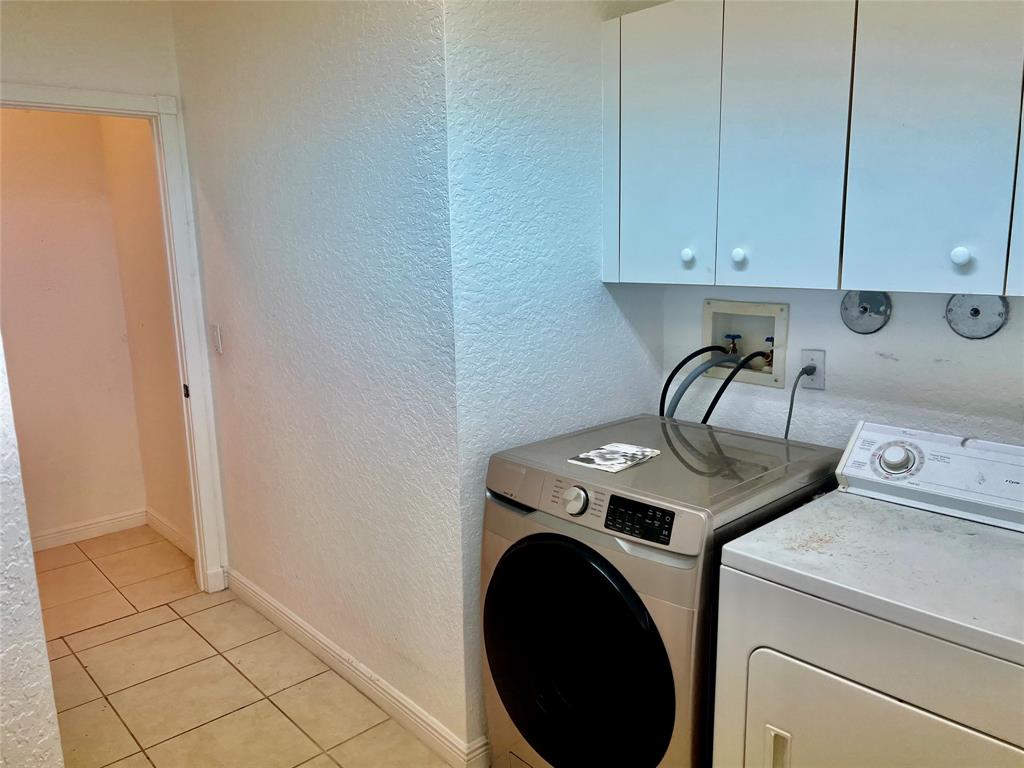 7932 Exeter Circle West, Unit 7932 Tamarac, FL 33321 - Photo 17 of 18 a utility room with dryer and washer