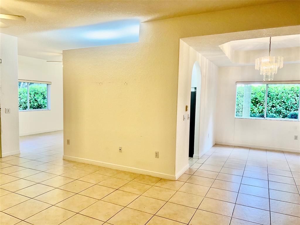 7932 Exeter Circle West, Unit 7932 Tamarac, FL 33321 - Photo 7 of 18 a view of entryway with wooden floor