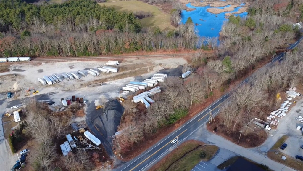 47 Main Street Oxford, MA 01540 - Photo 2 of 10 a view of a yard with wooden fence