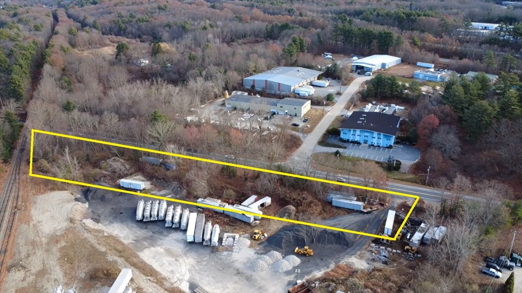 47 Main Street Oxford, MA 01540 - Photo 6 of 10 a view of a bench in a backyard