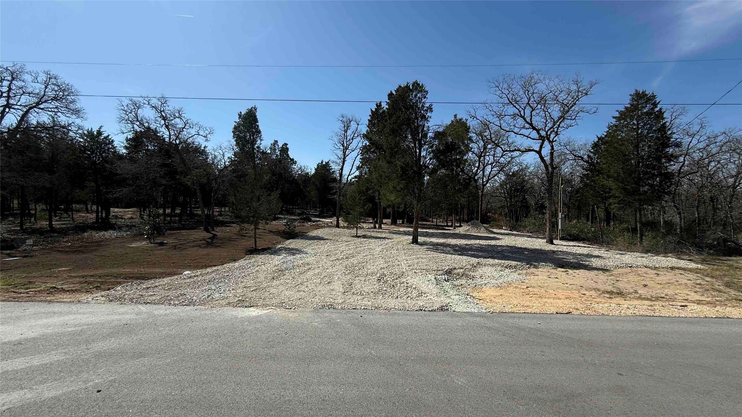 130 Las Cimas Drive Elgin, TX 78621 - Photo 1 of 5 a view of road with trees