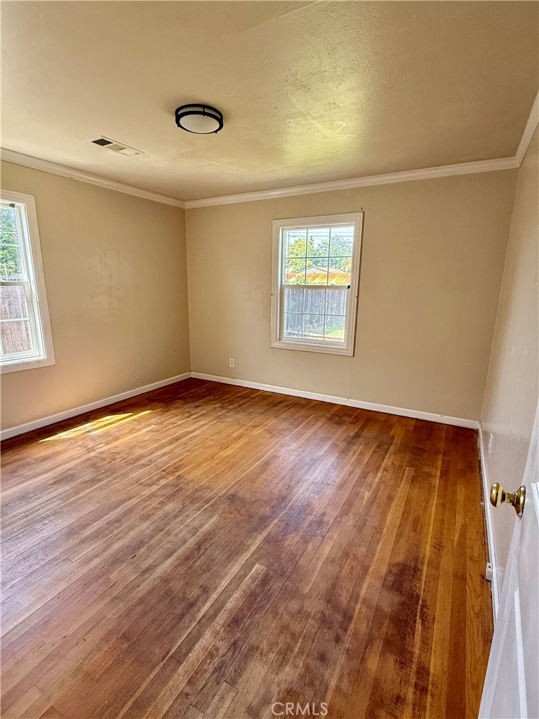 1127 West 23rd Street Merced, CA 95340 - Photo 11 of 23 Bedroom 2 with hardwood flooring