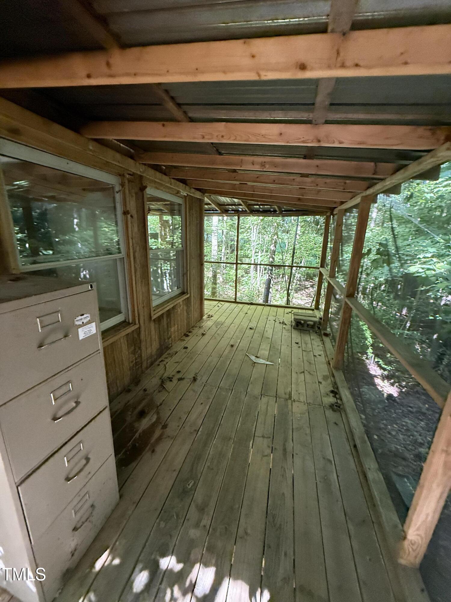 190 Louise Jenkins Road Moncure, NC 27559 - Photo 4 of 6 a view of empty room with wooden floor and fan