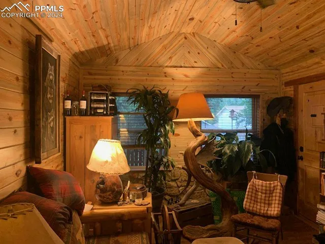 a living room with furniture and a lamp