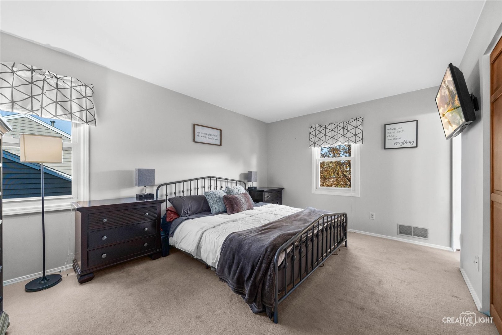 1348 Midway Avenue St. Charles, IL 60174 - Photo 12 of 23 a bedroom with a bed and a flat tv screen on the dresser