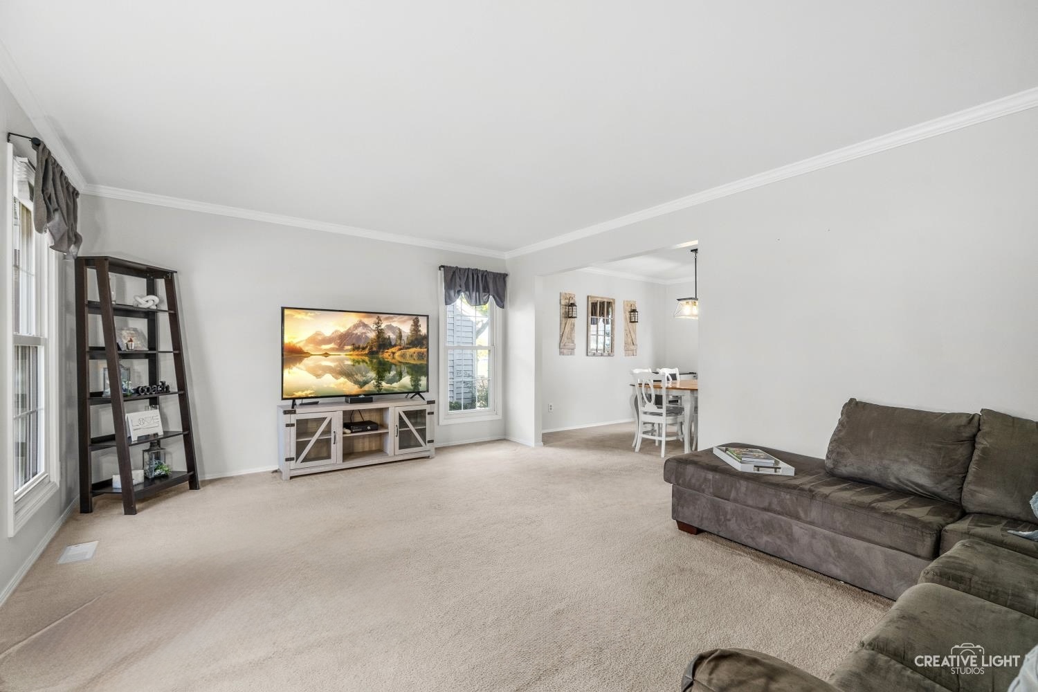 1348 Midway Avenue St. Charles, IL 60174 - Photo 2 of 23 a living room with furniture and a flat screen tv