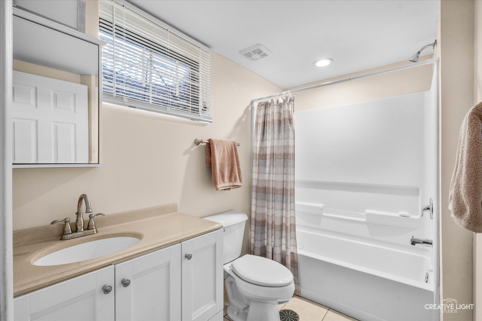 1348 Midway Avenue St. Charles, IL 60174 - Photo 21 of 23 a bathroom with a granite countertop sink toilet and shower