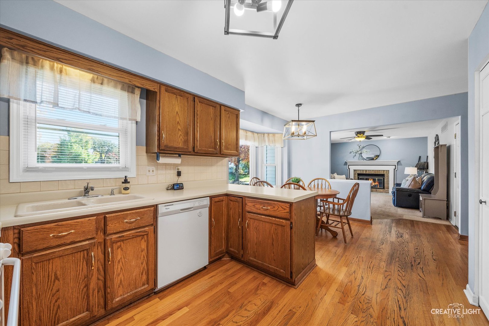 1348 Midway Avenue St. Charles, IL 60174 - Photo 6 of 23 a kitchen with a sink a table and chairs in it