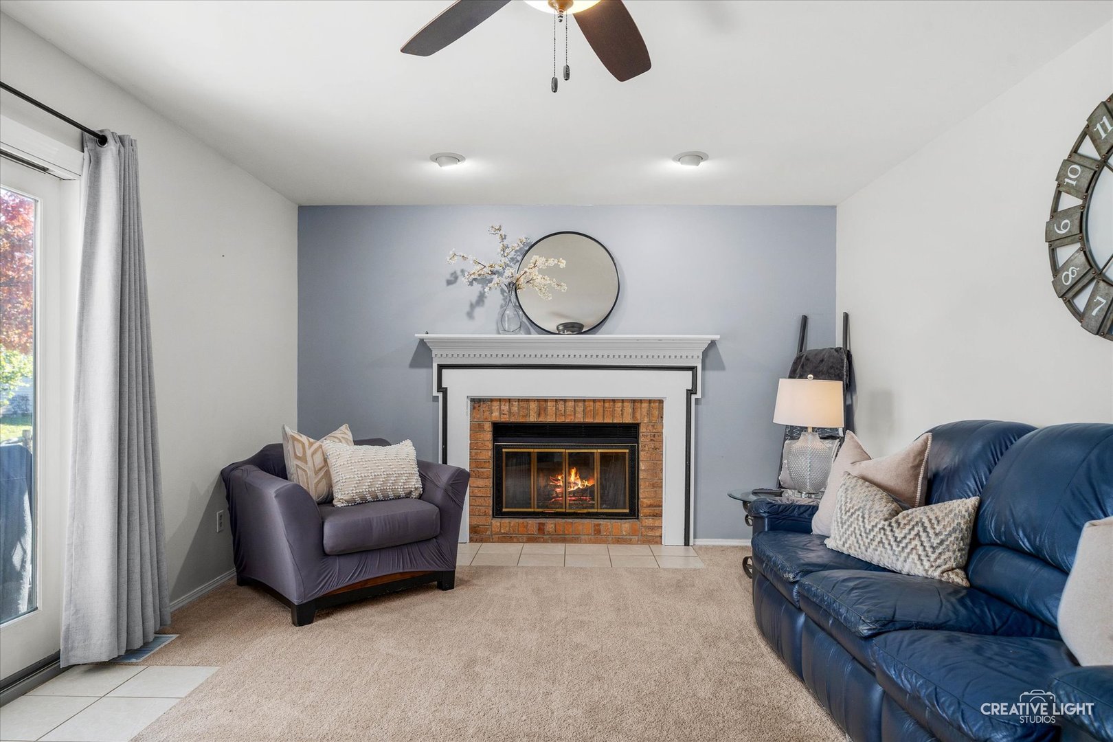 1348 Midway Avenue St. Charles, IL 60174 - Photo 9 of 23 a living room with furniture and a fireplace