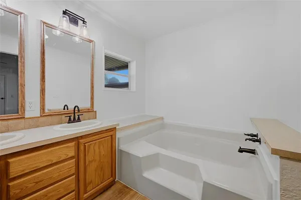 a bathroom with a bathtub and a sink